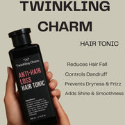 Hand holding a bottle of Twinkling Charm Anti-Hair Loss Hair Tonic with product details on a beige background.