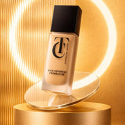 Foundation bottle on a gold stand with a warm glow