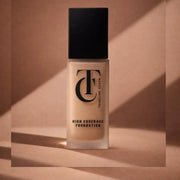 Foundation bottle with 'TC' logo on a beige background