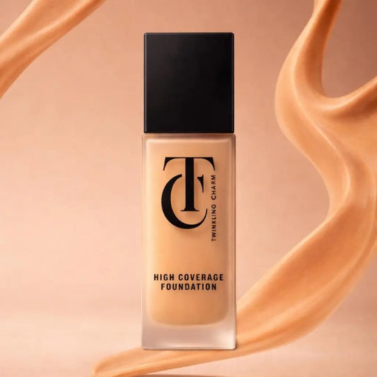 Foundation bottle with a swatch of foundation on a peach background
