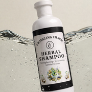 Bottle of Twinkling Charm Herbal Shampoo with water splash background