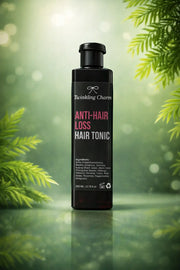 Bottle of Twinkling Charm Anti-Hair Loss Hair Tonic with green foliage in the background