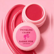 Pink lip balm container labeled 'Twinkling Charm Barbie Pink Lip Balm' on a pink background