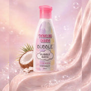 Bottle of Twinkling Charm Bubble Bath for Kids Coconut on a pink background with bubbles and coconut.