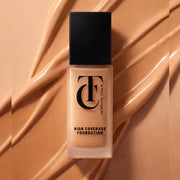 Foundation bottle with 'Twinkling Charm' branding on a beige background
