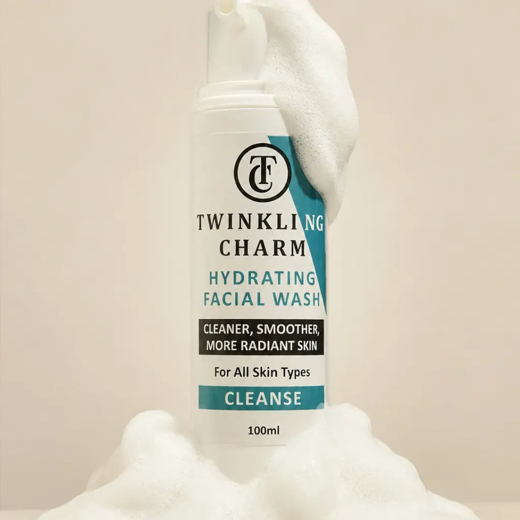 Twinkling Charm hydrating facial wash bottle held by a hand against a beige background