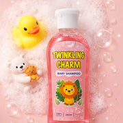 Baby shampoo bottle labeled 'Twinkling Charm' with a yellow rubber duck and white bear toy on a pink bubble background.
