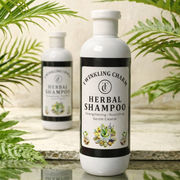 Two bottles of Twinkling Charm Herbal Shampoo with green leaves in the background