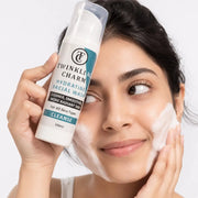 Woman applying facial wash to her face with a Twinkling Charm product in the foreground.