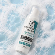 Twinkling Charm hydrating facial wash bottle on a background of bubbles